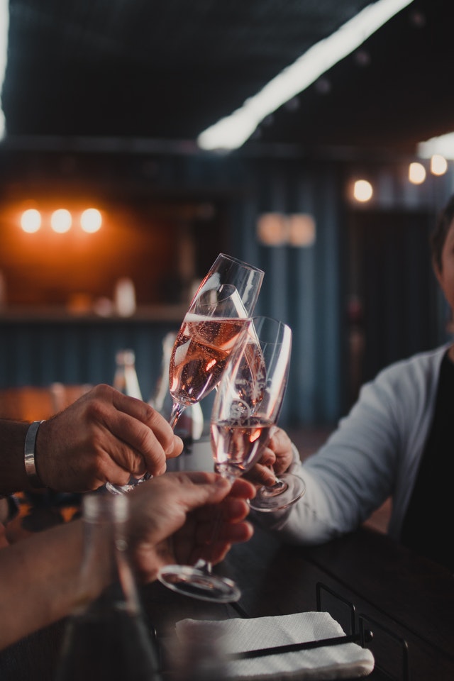 people clinking glasses